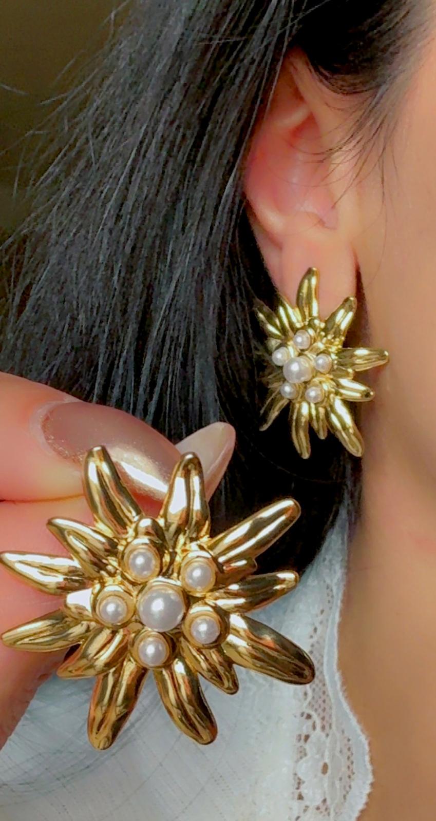 Bold gold flower earrings with pearls, modern statement design