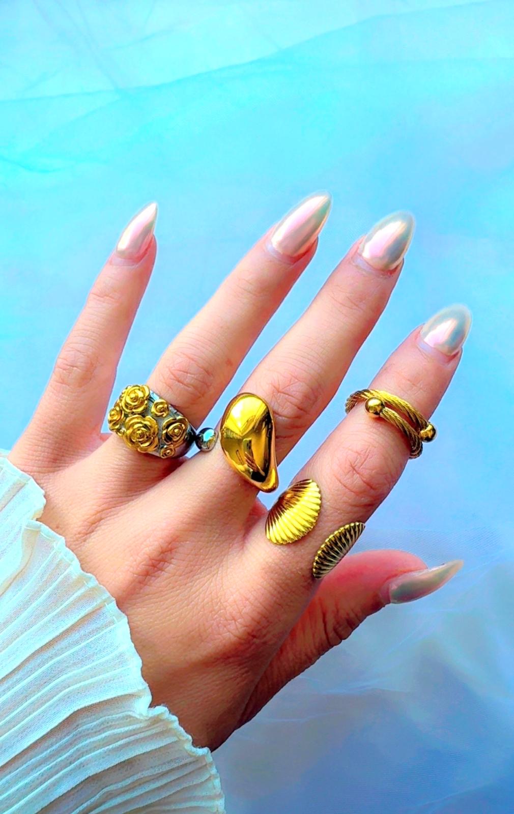 Bold open band ring with abstract dome design in gold and silver tones