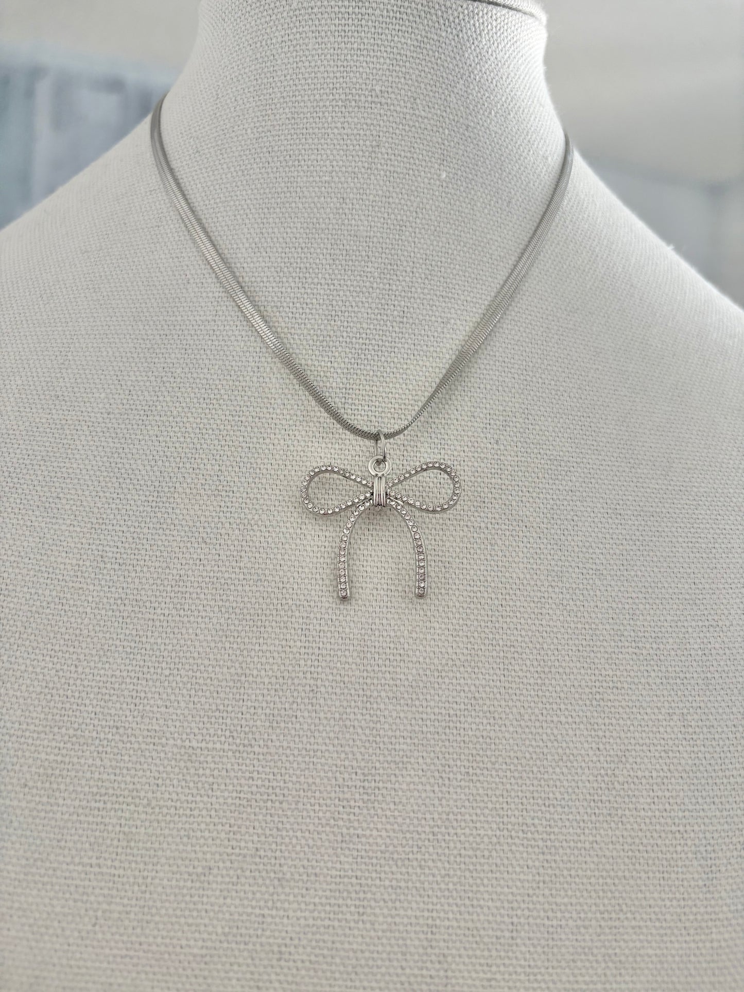 Minimalist silver bow necklace for women