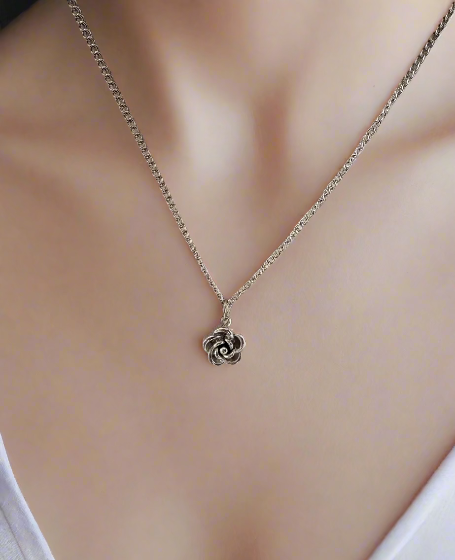 Silver necklace with a rose pendant