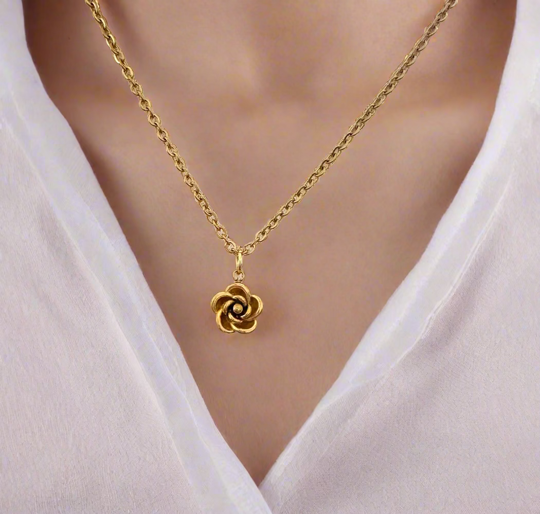Gold necklace with a rose pendant