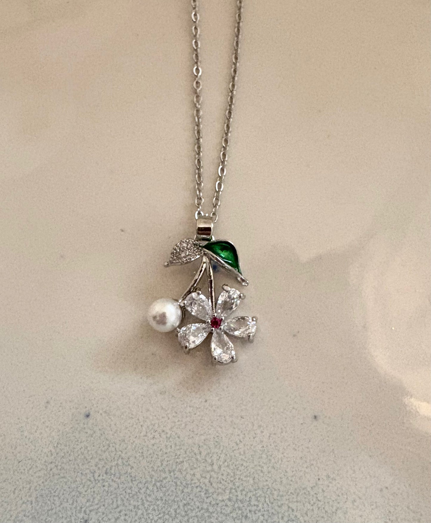 Silver floral pendant necklace with pearl and crystal details
