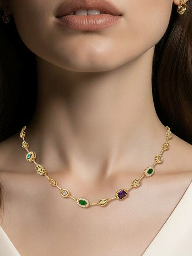 Gold necklace with gemstones worn by a model