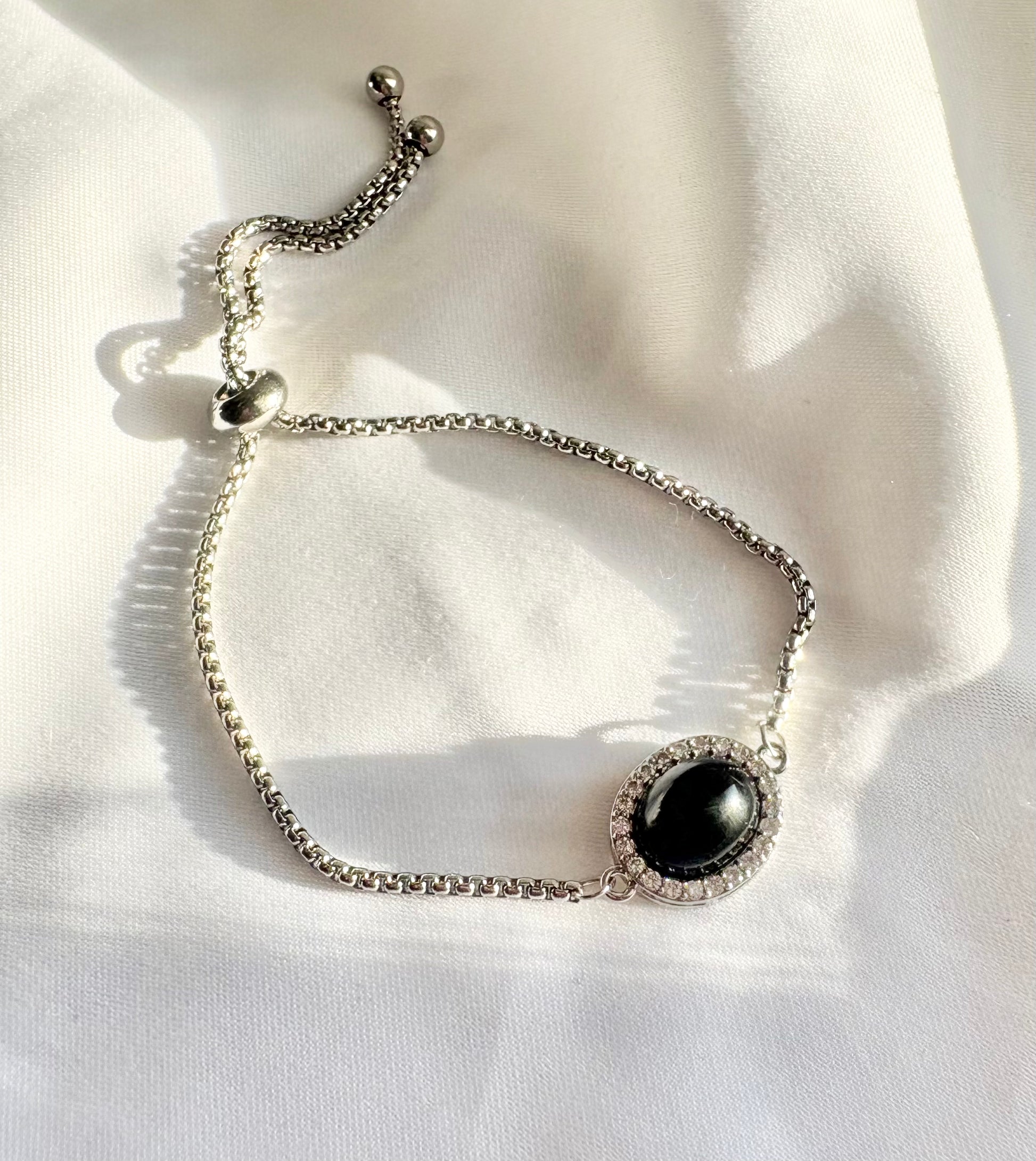 Silver slider bracelet with black obsidian-style stone
