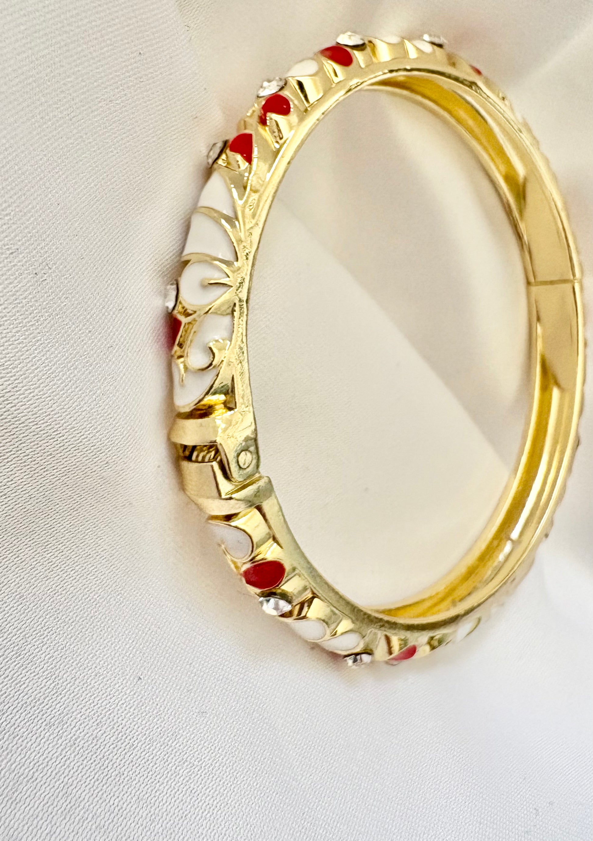Close-up of enamel heart bangle design