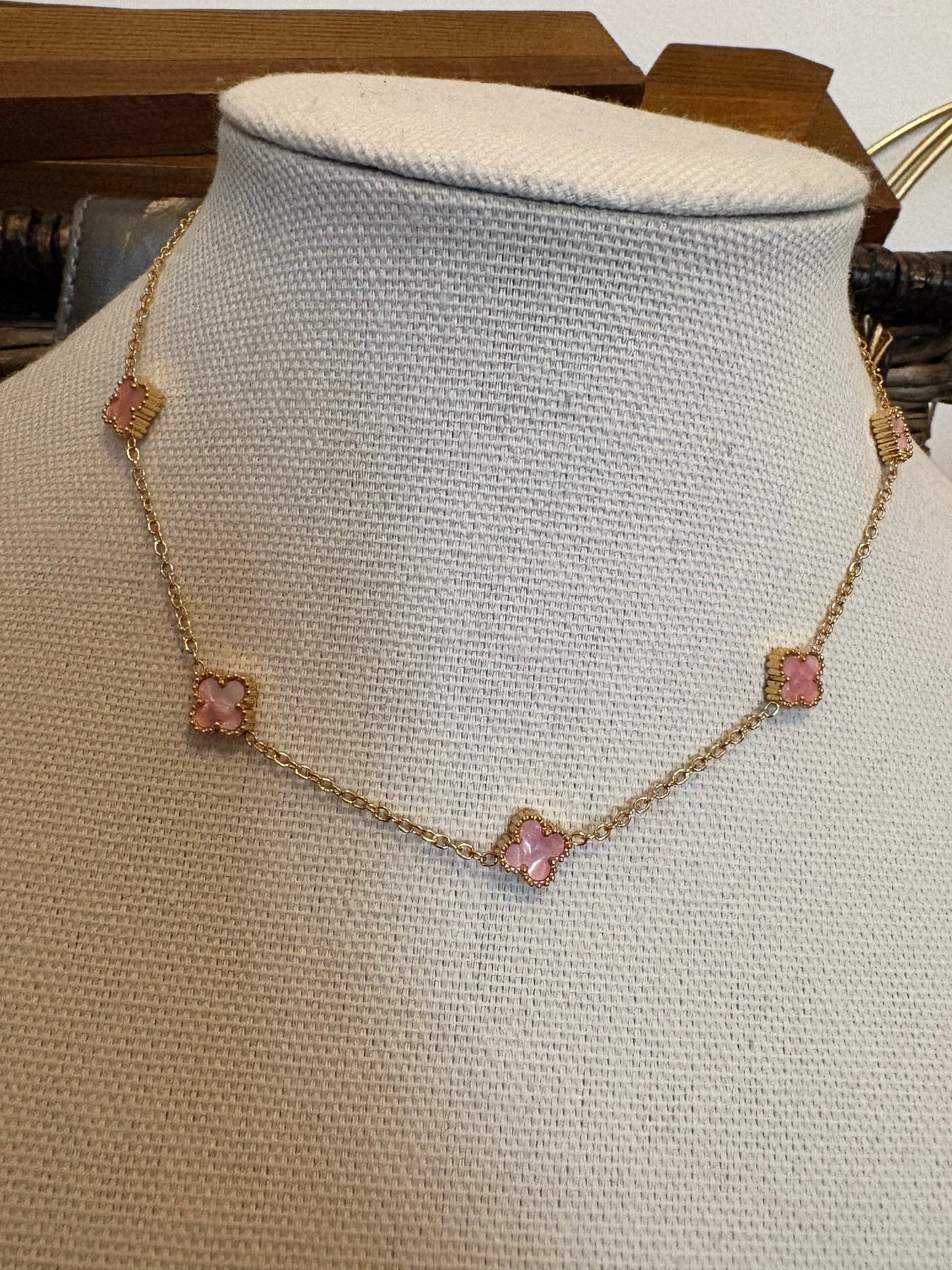 Necklace with pink stones on a mannequin bust
