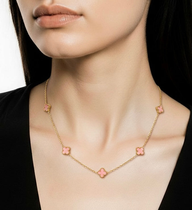 Necklace with pink flower pendants worn by a model 