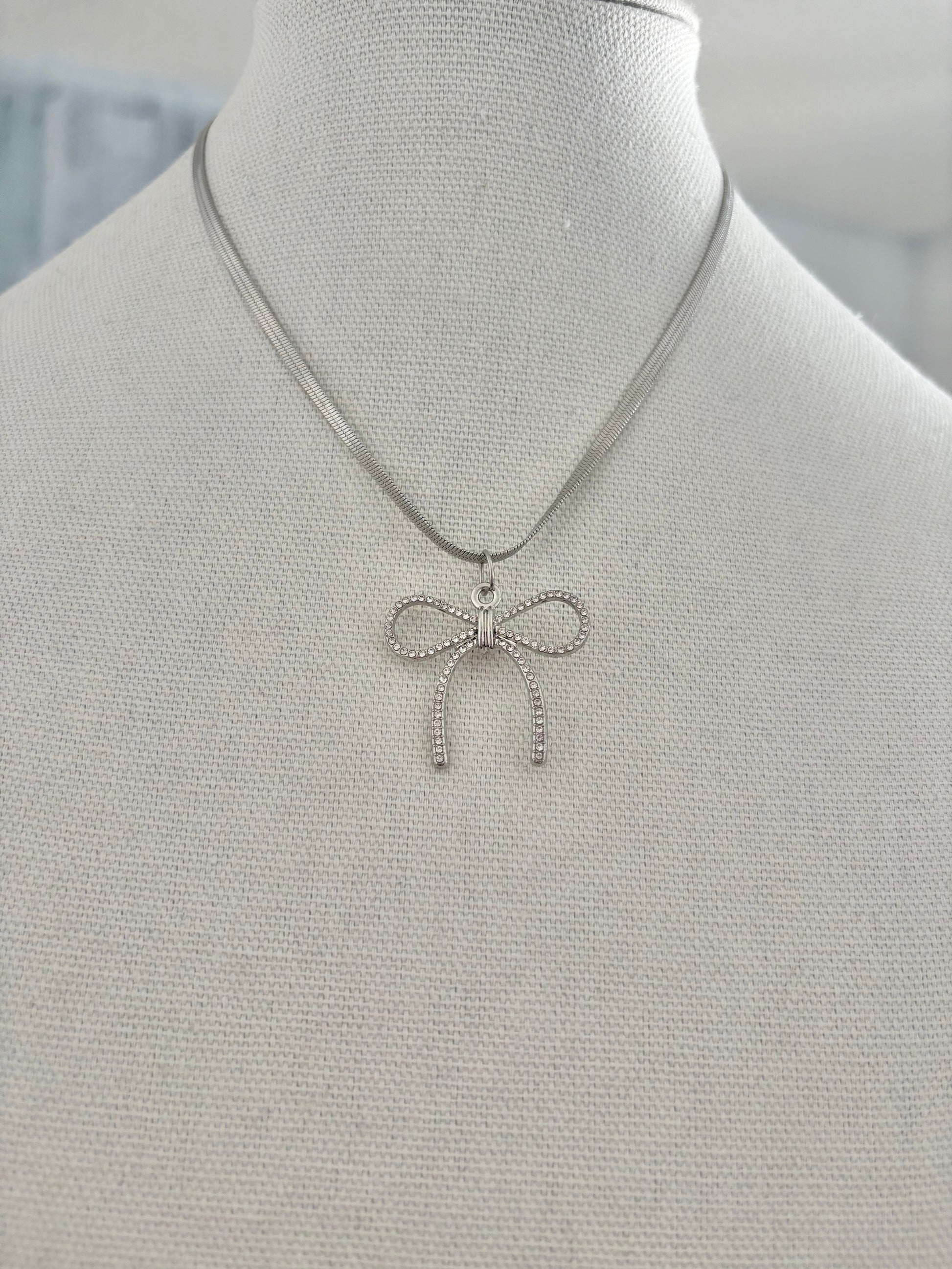 Minimalist silver bow necklace for women