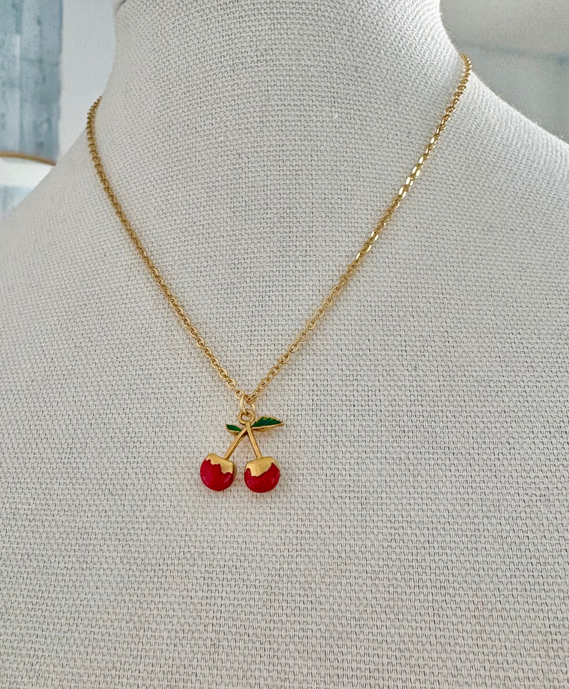 Gold cherry pendant necklace with red enamel cherries