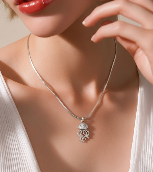 Silver jellyfish pendant necklace on snake chain