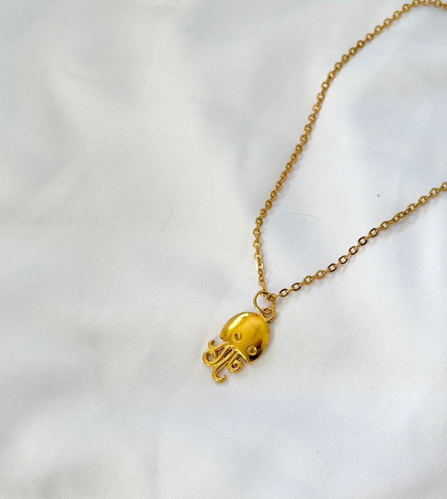 Minimal gold jellyfish jewelry