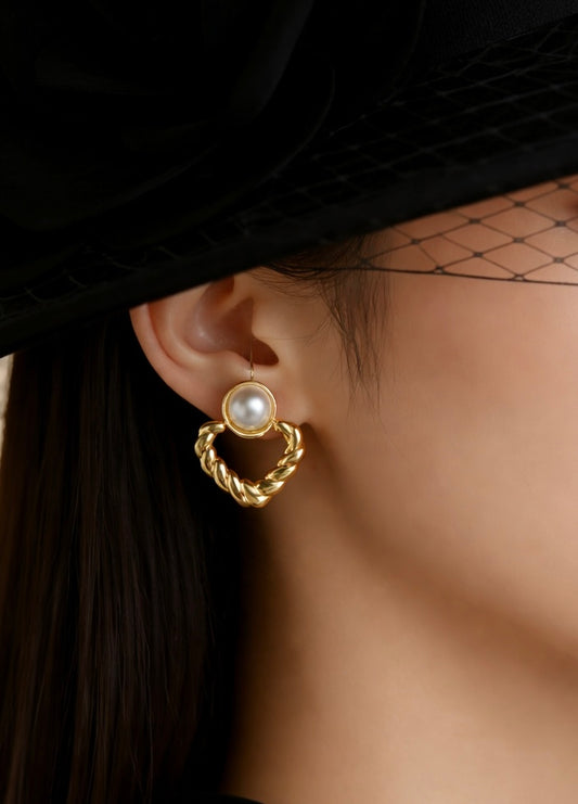 Modern gold heart earrings with pearl detail
