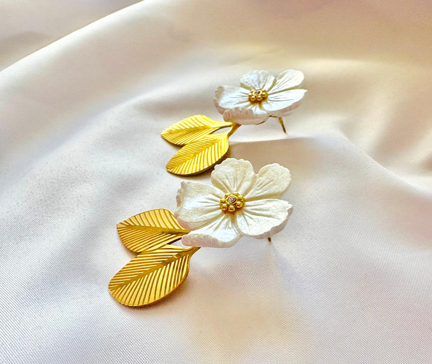 White flower drop earrings with gold leaves