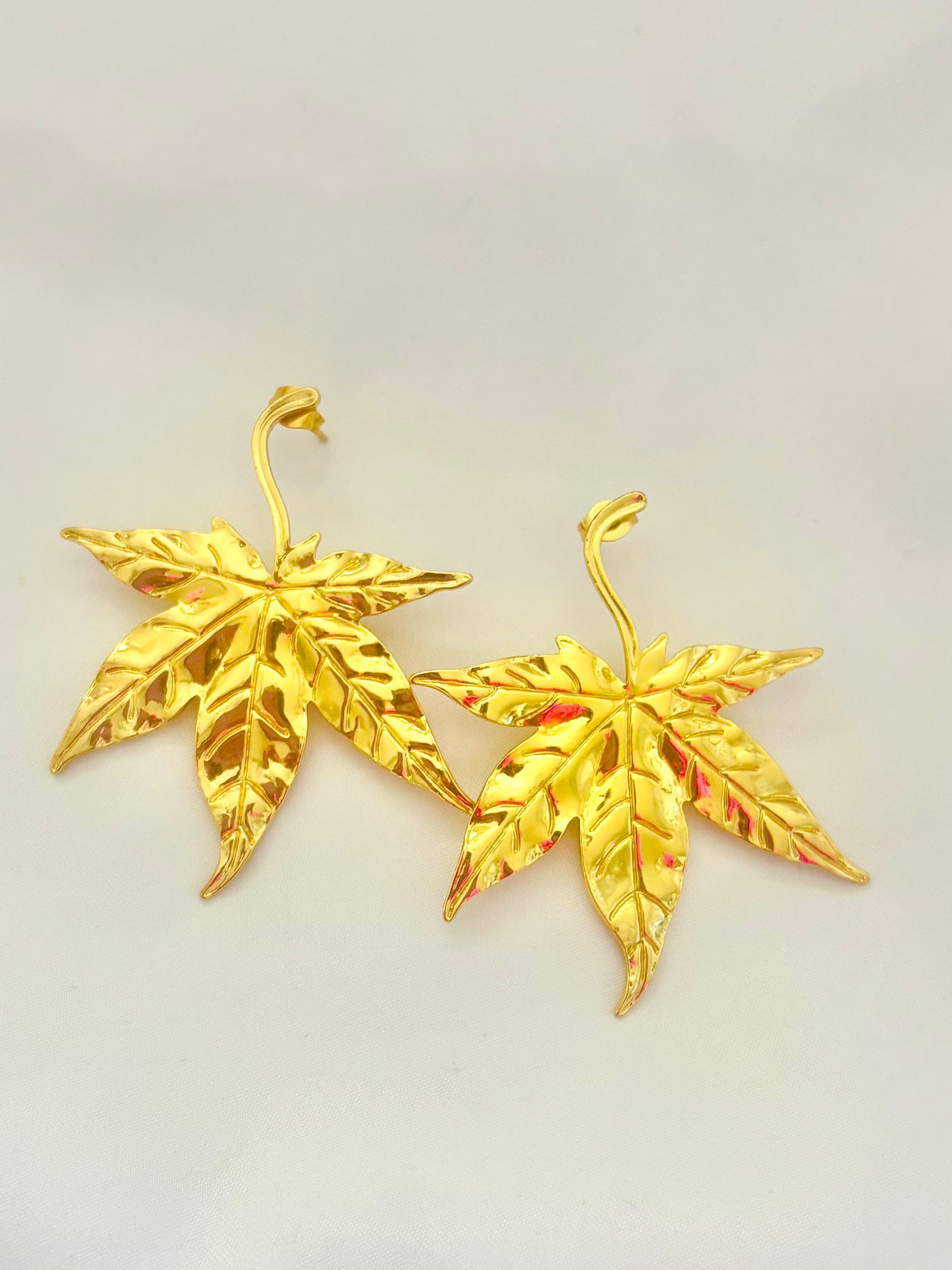 Gold maple leaf statement earrings