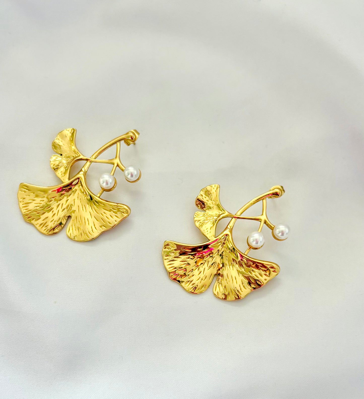 Gold ginkgo leaf drop earrings with pearl accents
