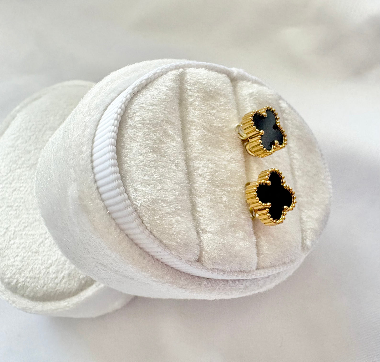 Pair of black and gold earrings