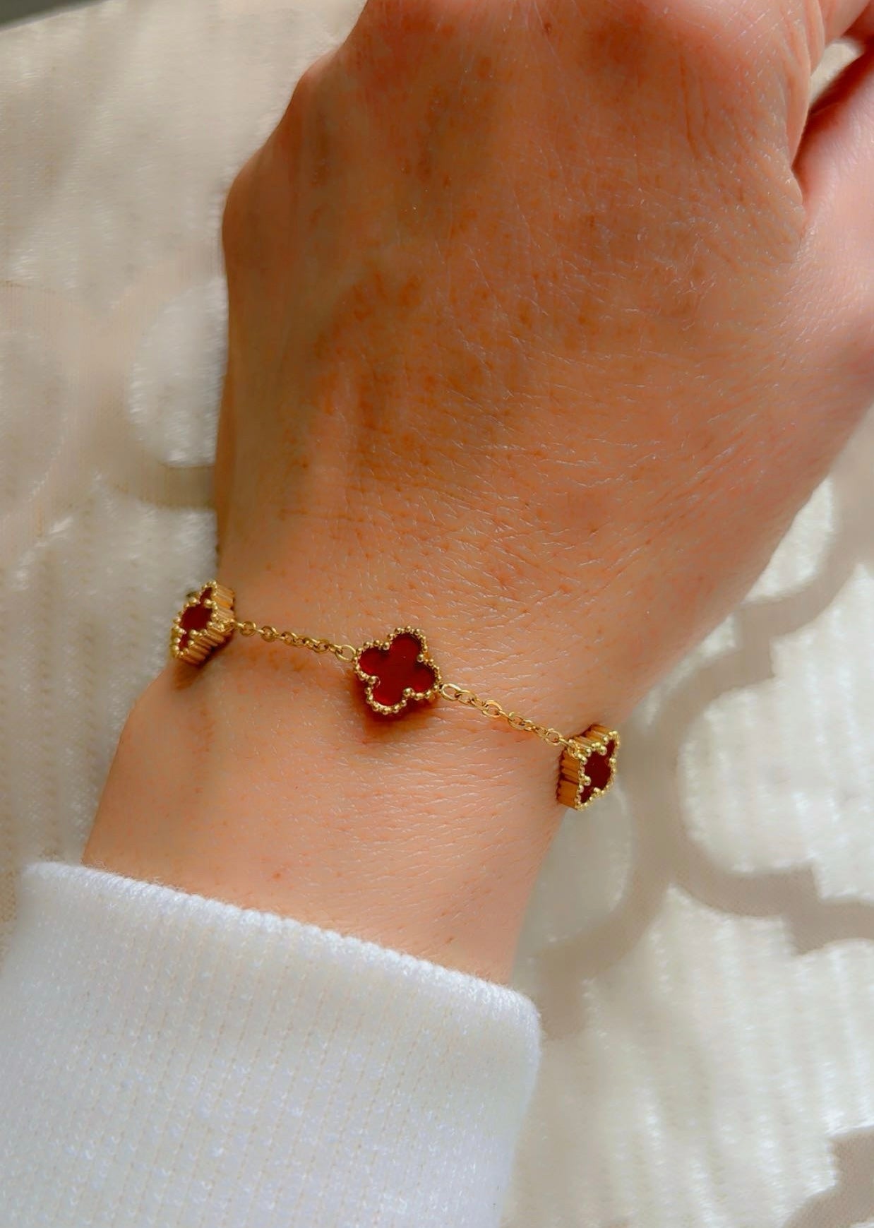 18k Gold plated bracelet with red wine clover charms.