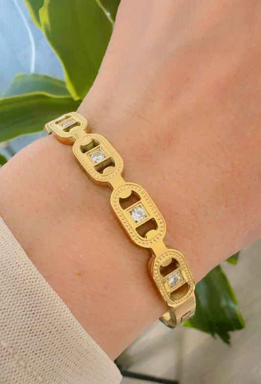 Gold Bangle with zircon stones 