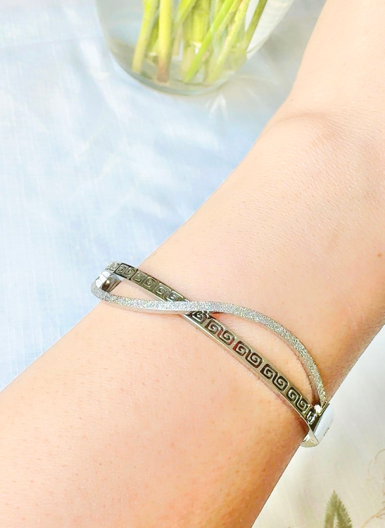 Silver bracelet on a wrist