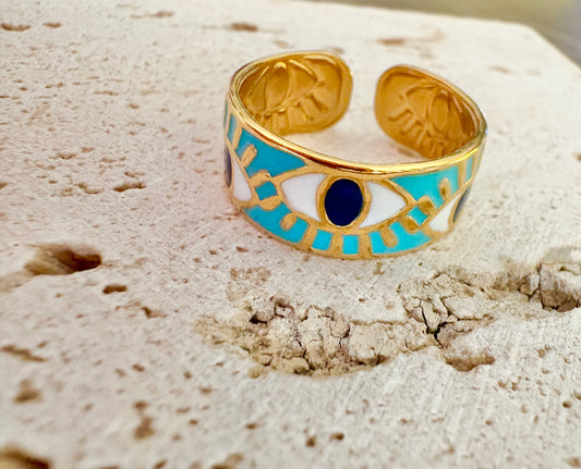 Gold-plated open ring with turquoise, white, and dark blue enamel evil eye motifs.
