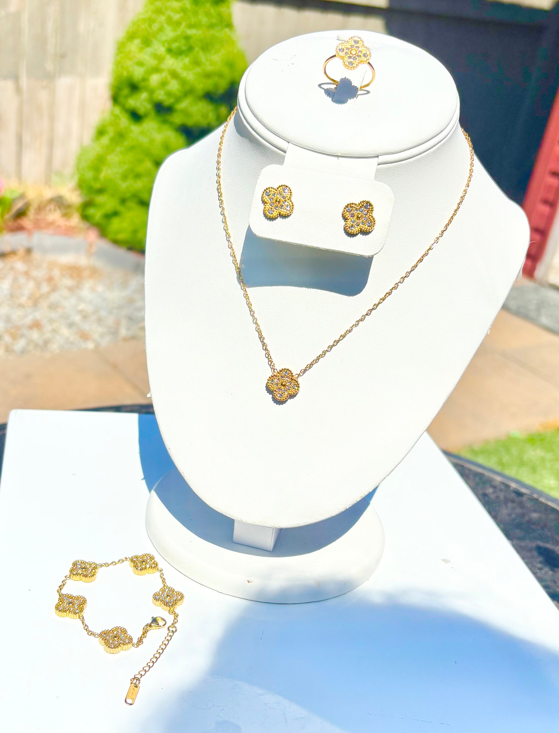 A necklace, matching earrings, a ring, and a bracelet.