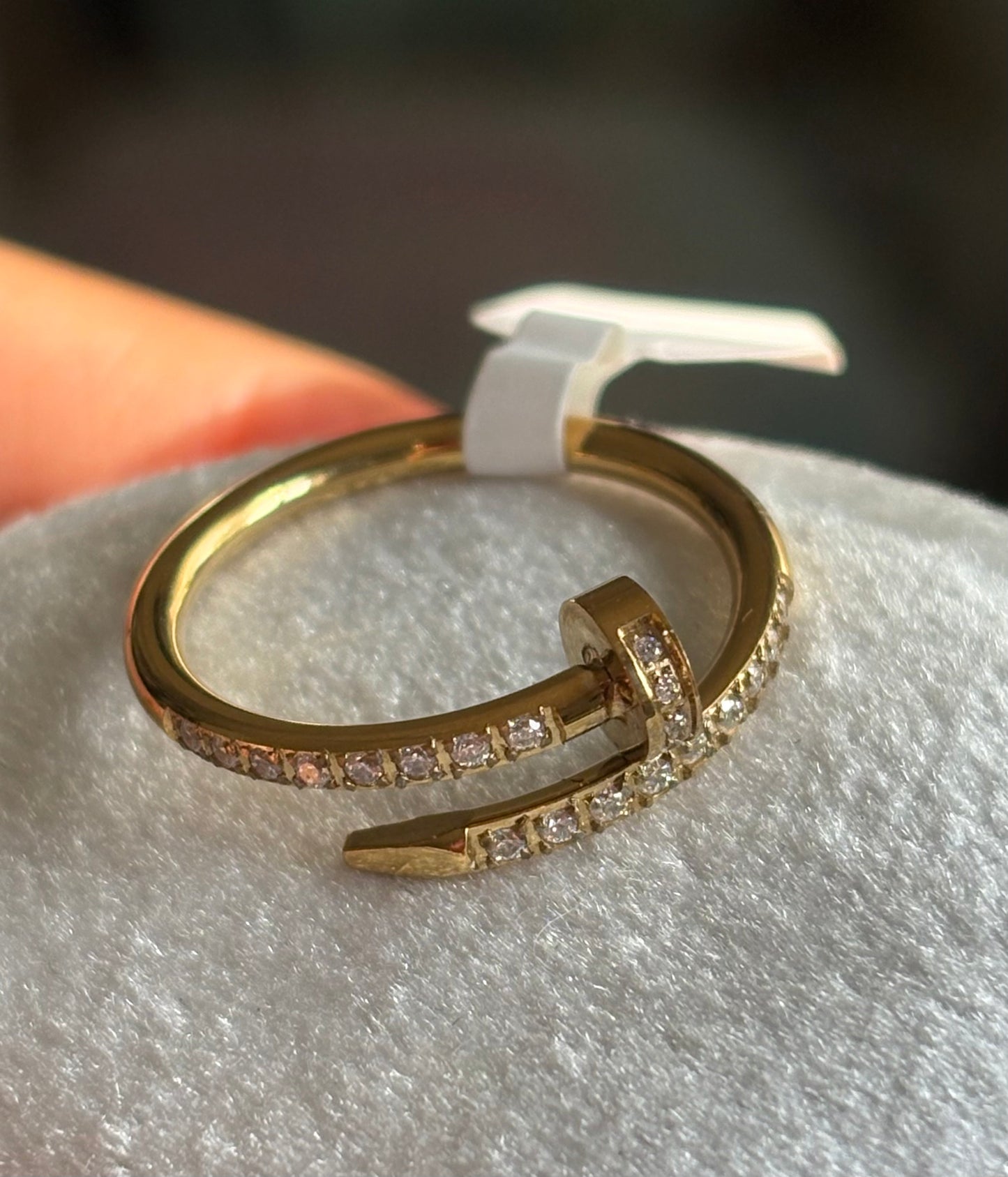 A gold ring with pavé-set clear stones