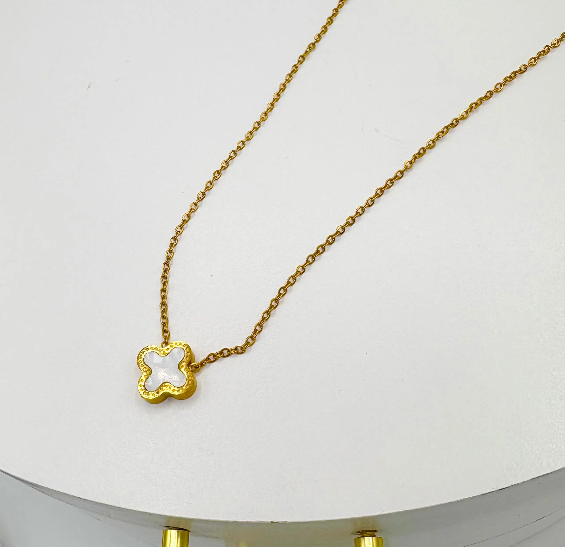 18k gold plated necklace with a small clover-shaped pendant 