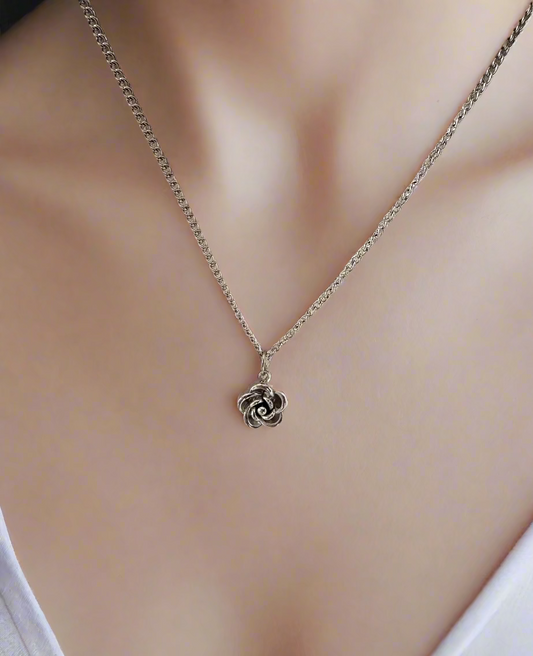 Silver necklace with a rose pendant