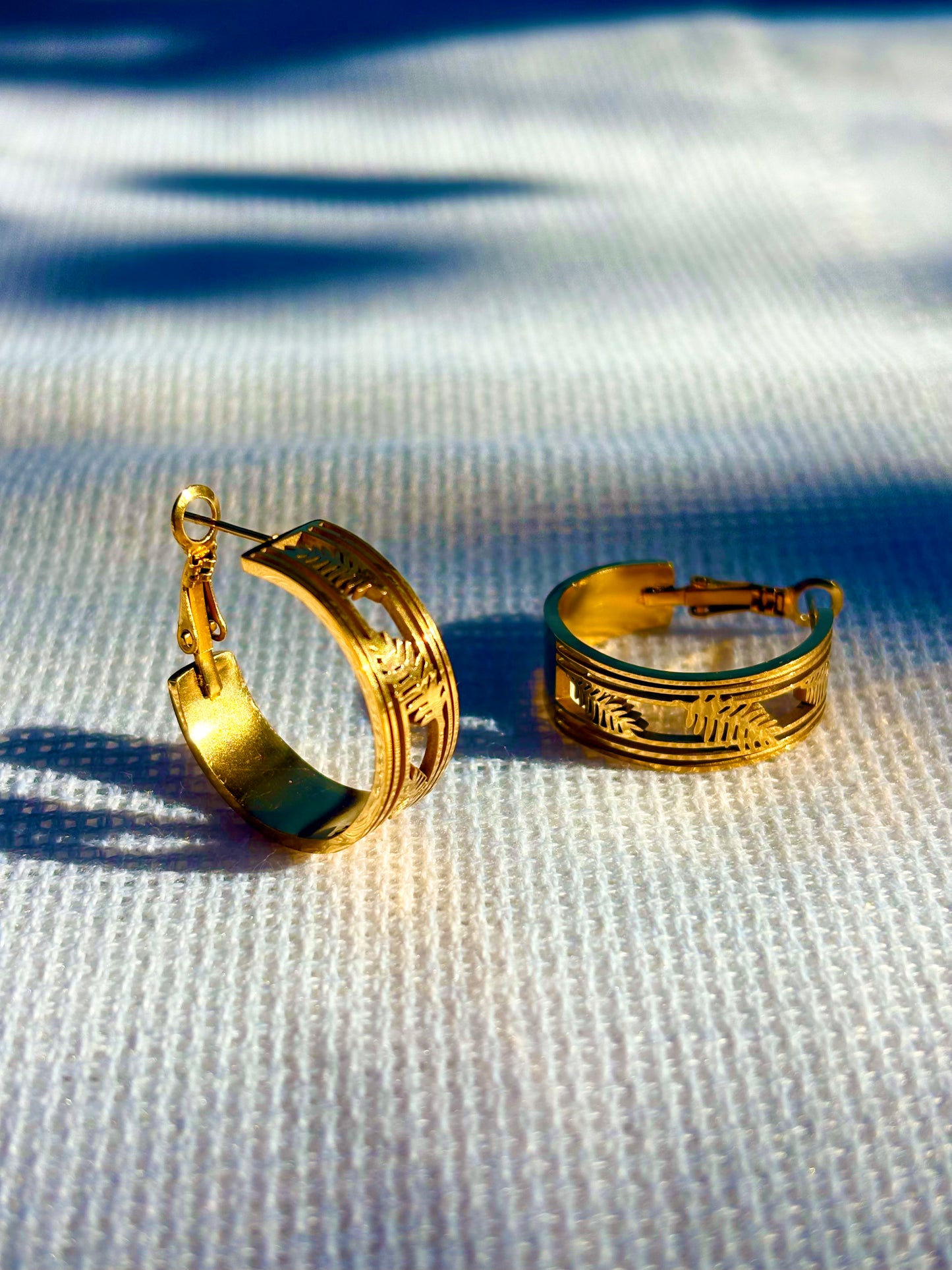 Back view of leaf engraved 18K gold plated hoop earrings