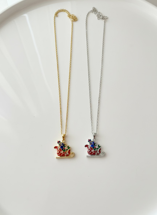 Two necklaces with Christmas sleigh pendants 