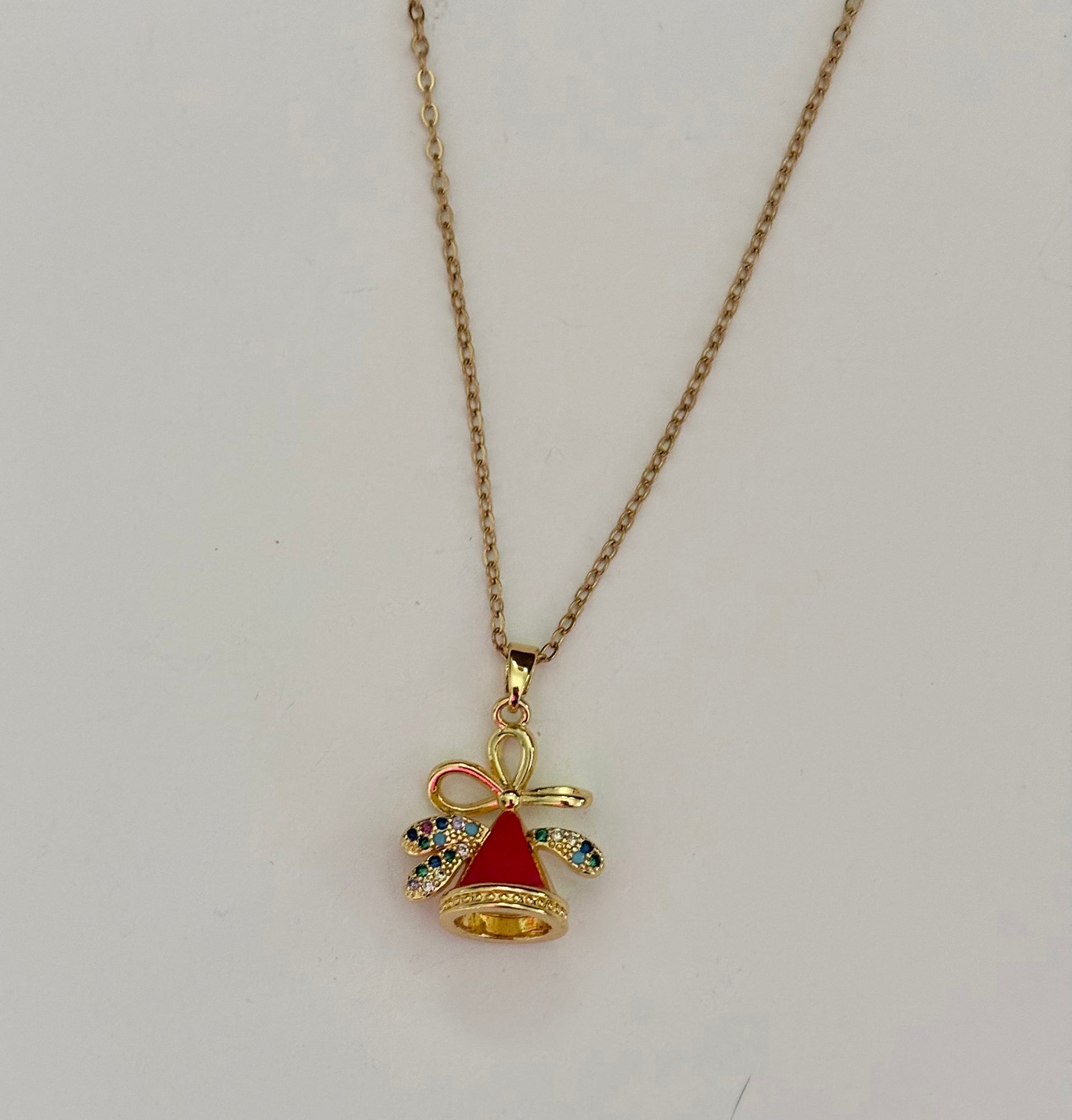 Gold necklace with a red angel pendant 