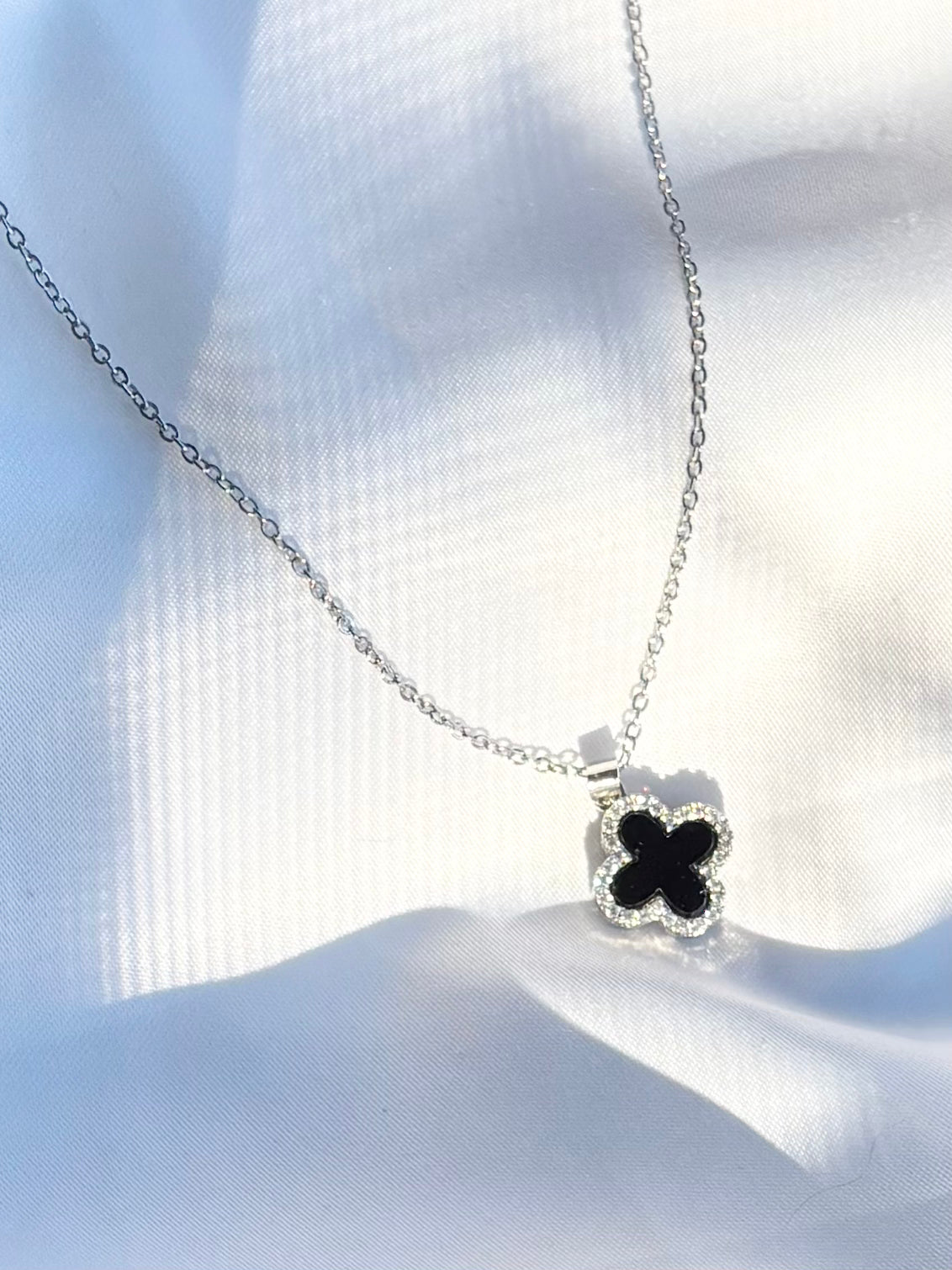 Black clover charm with crystal border on adjustable stainless steel chain