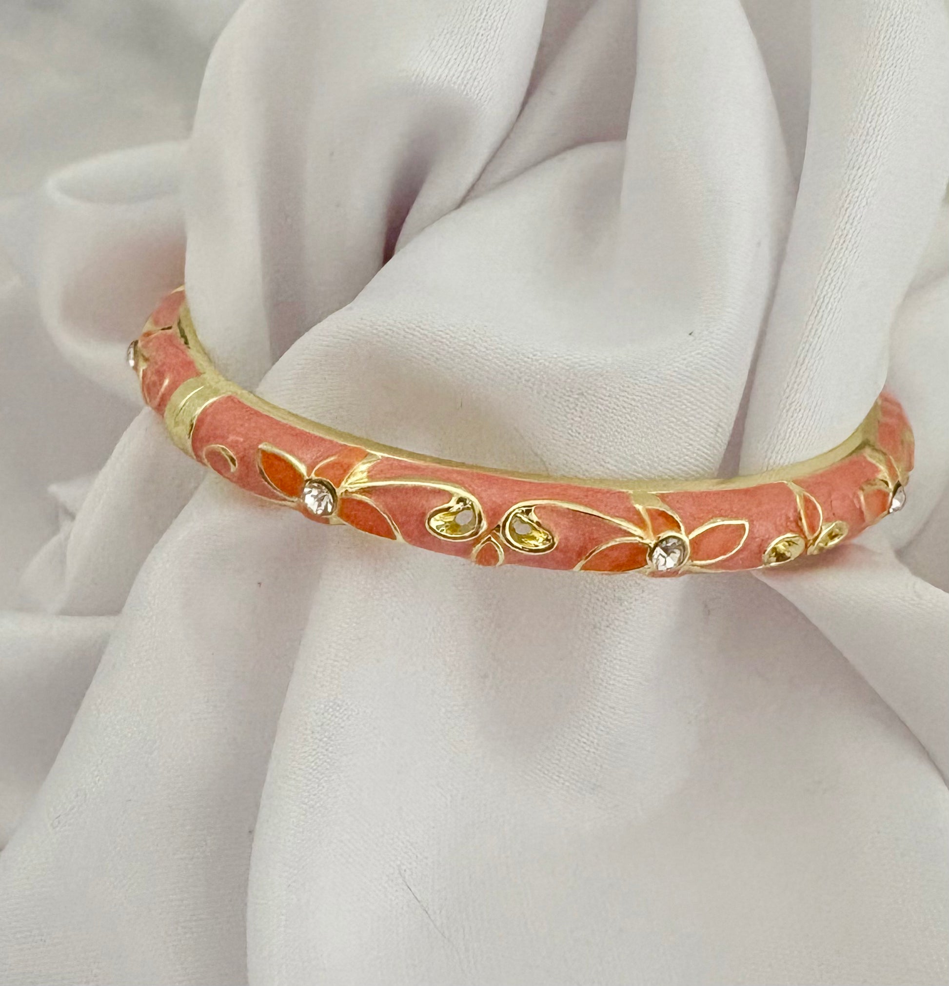 Non-tarnish pink floral bangle with crystals and spring hinge clasp