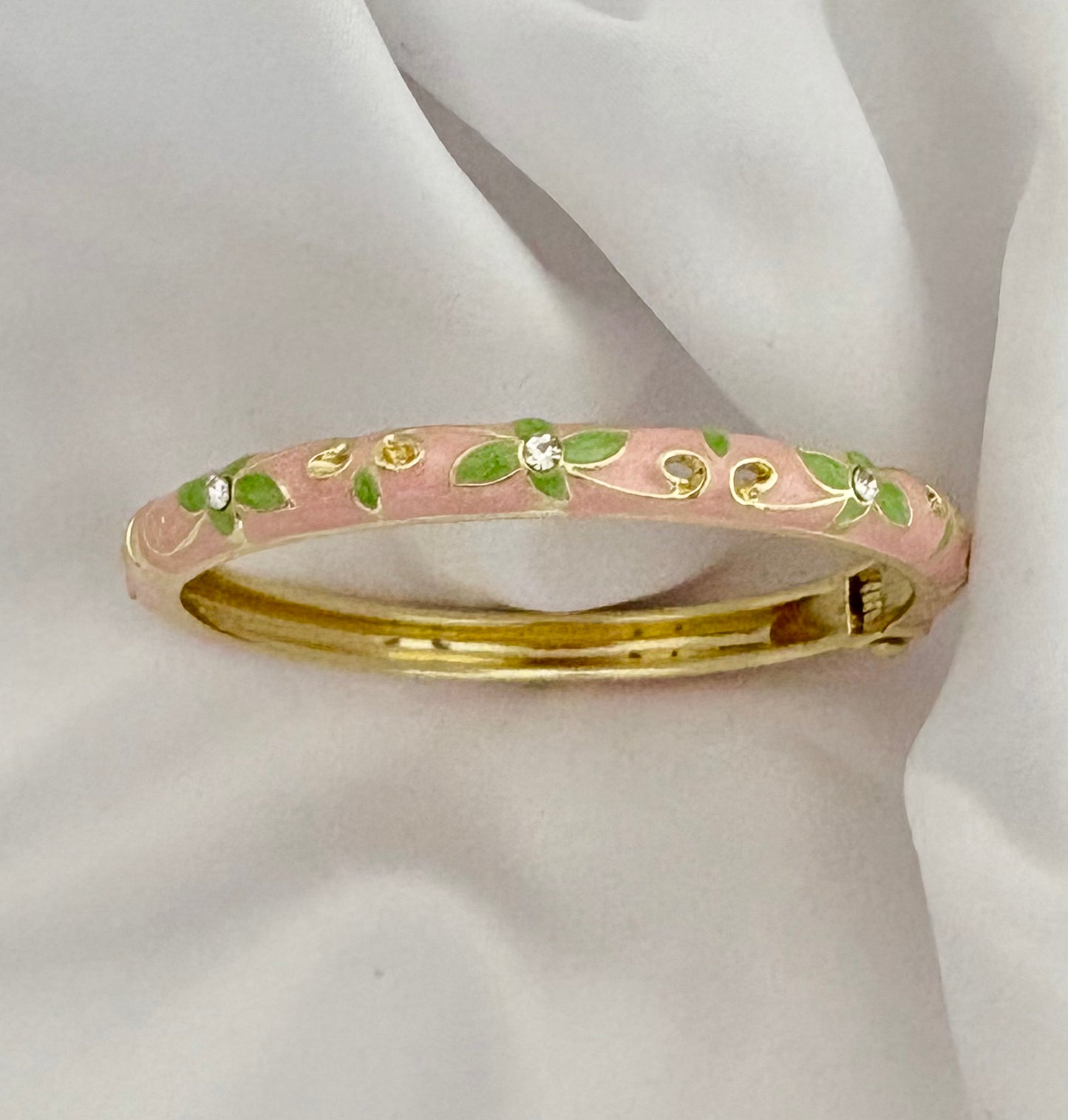 Elegant pink enamel bracelet with floral green accents, 6 cm size