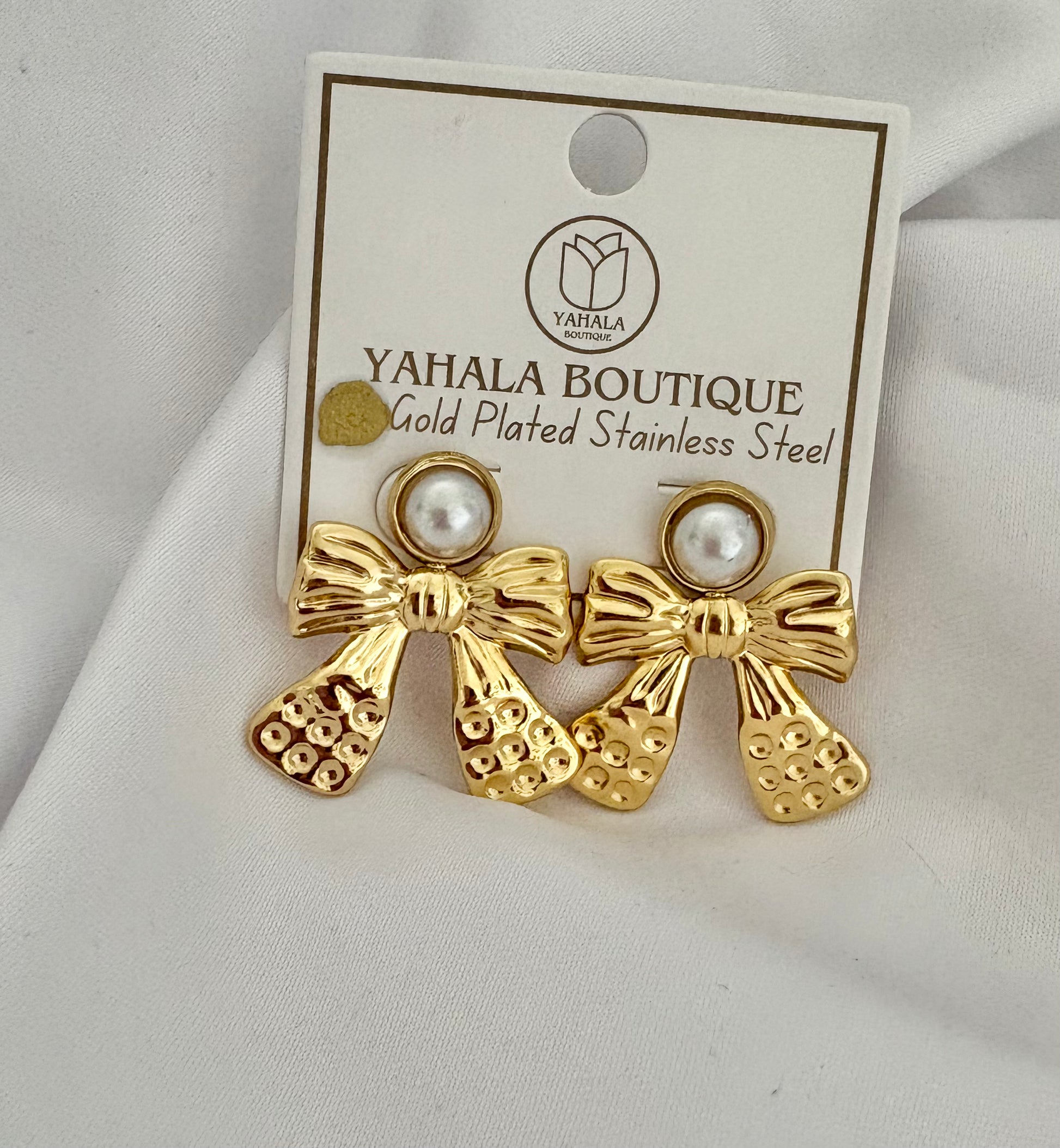 Waterproof stainless steel bow drop earrings with pearl top