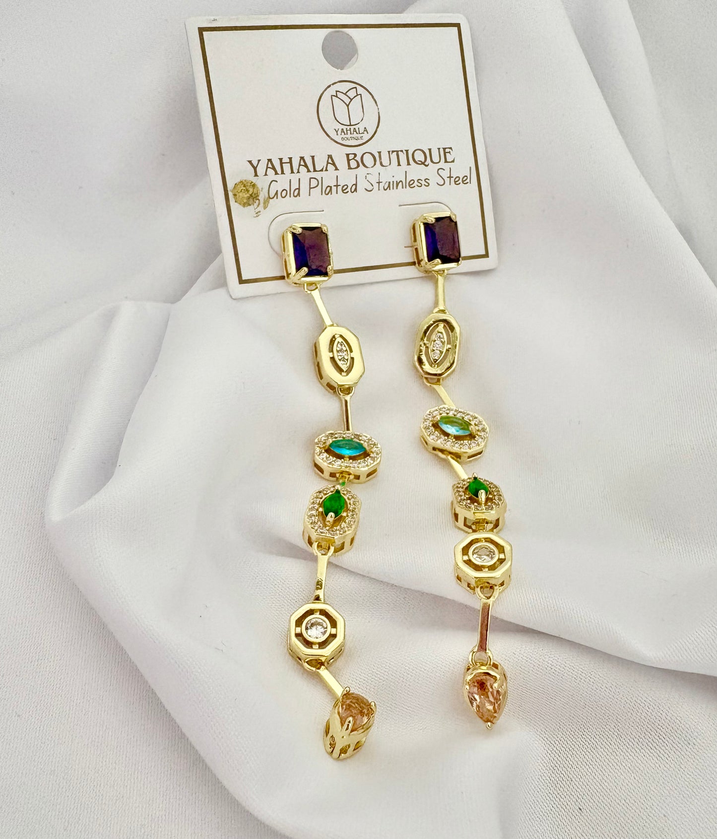 Gold-plated earrings with gemstones on a white background, branded 'Yahala Boutique'.