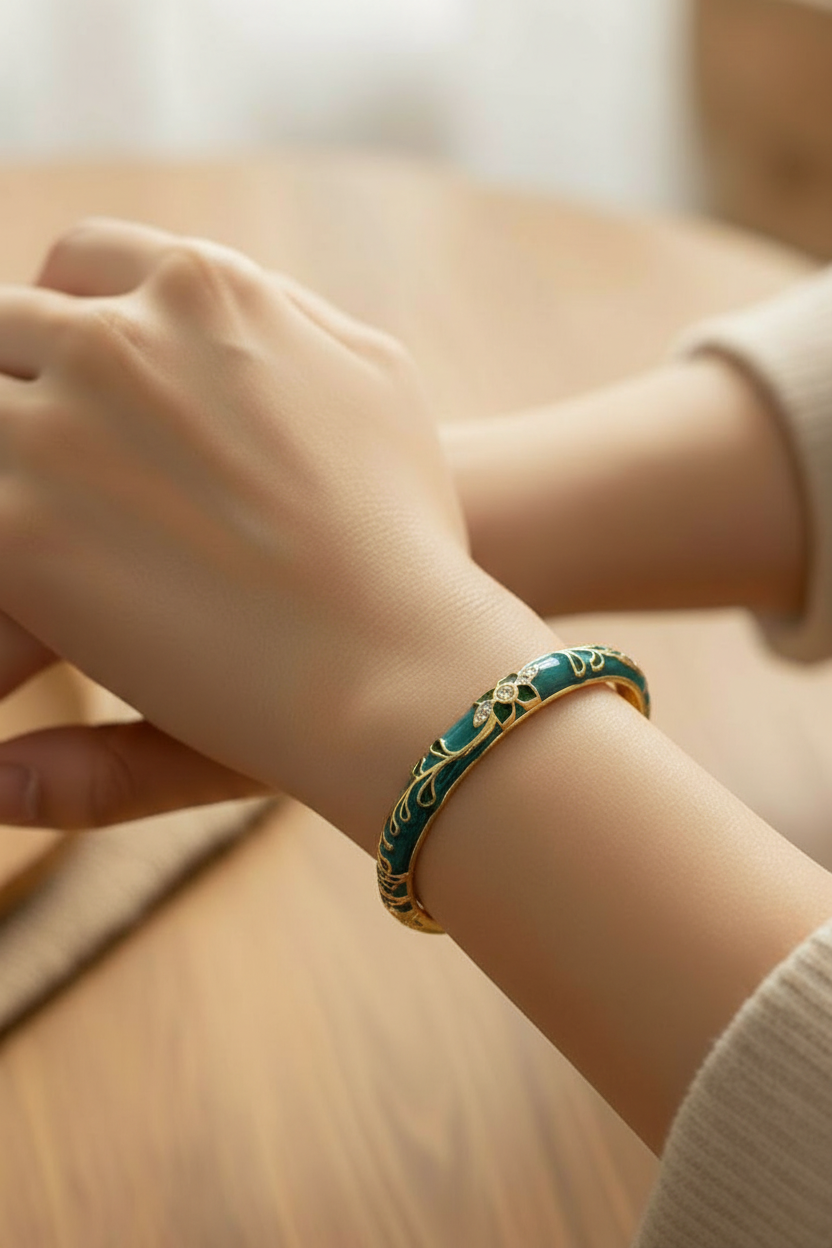 Non tarnish dark green enamel bracelet with gold detailing, 6 cm diameter