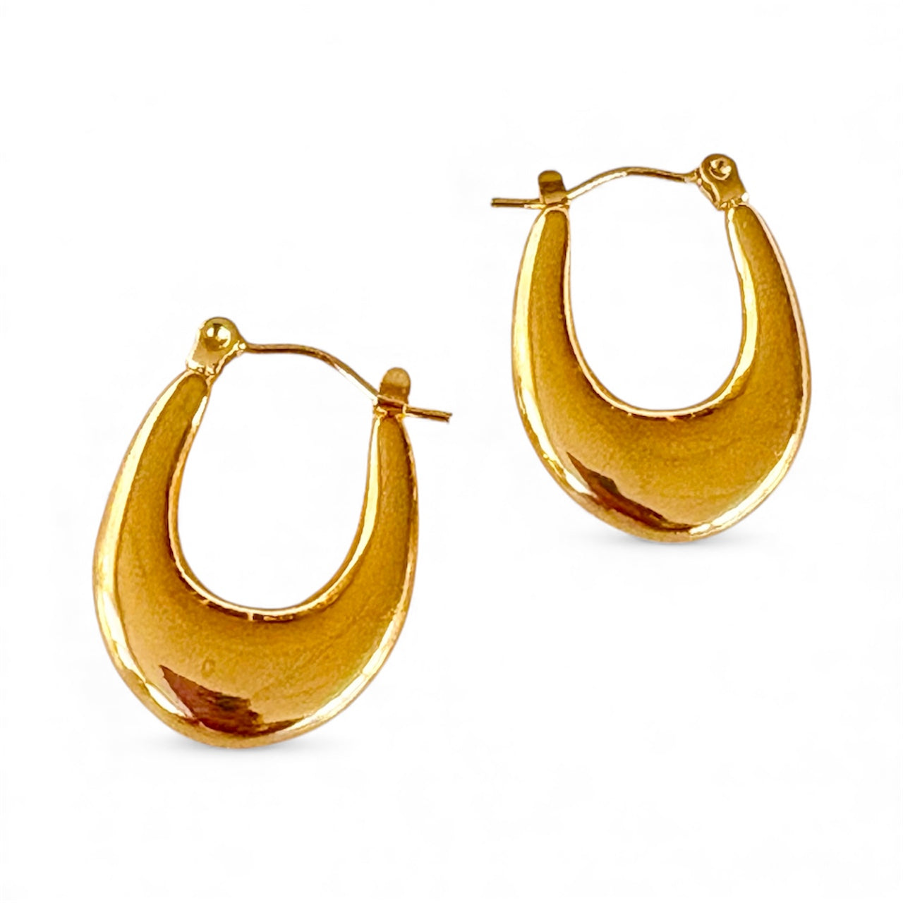 Front view of gold crescent hoop earrings with a polished finish and latch closure