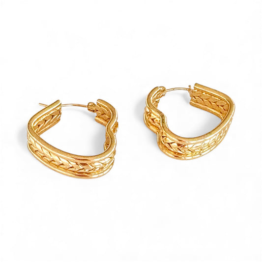 Front view of silver braided heart hoop earrings with a woven pattern and 2.5 cm dimensions