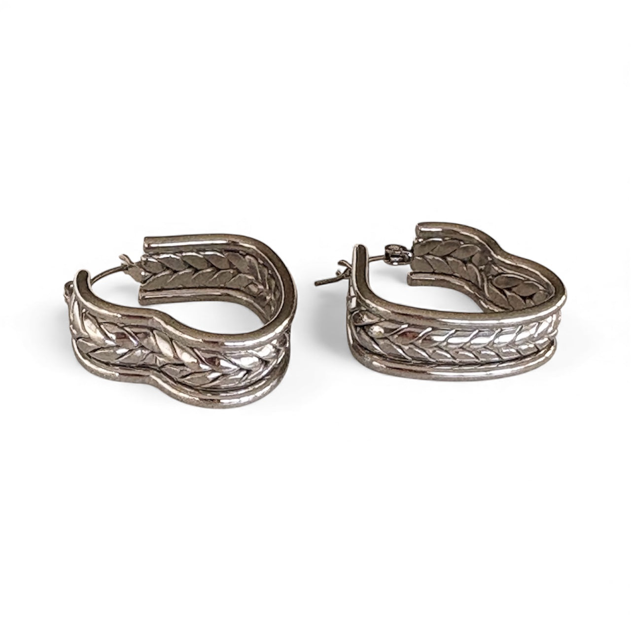 Pair of gold braided heart hoop earrings featuring a unique curved shape and woven design, sized at 2.5 cm