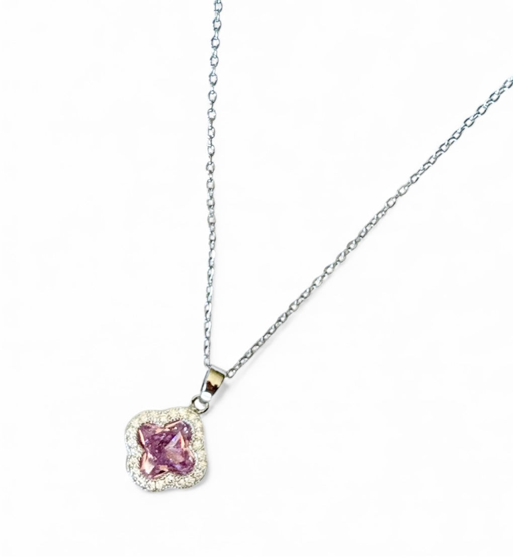 Silver Necklace with a pink clover pendant on a white background