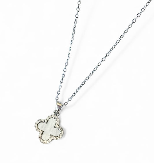 Butterfly-shaped pendant on a chain against a white background