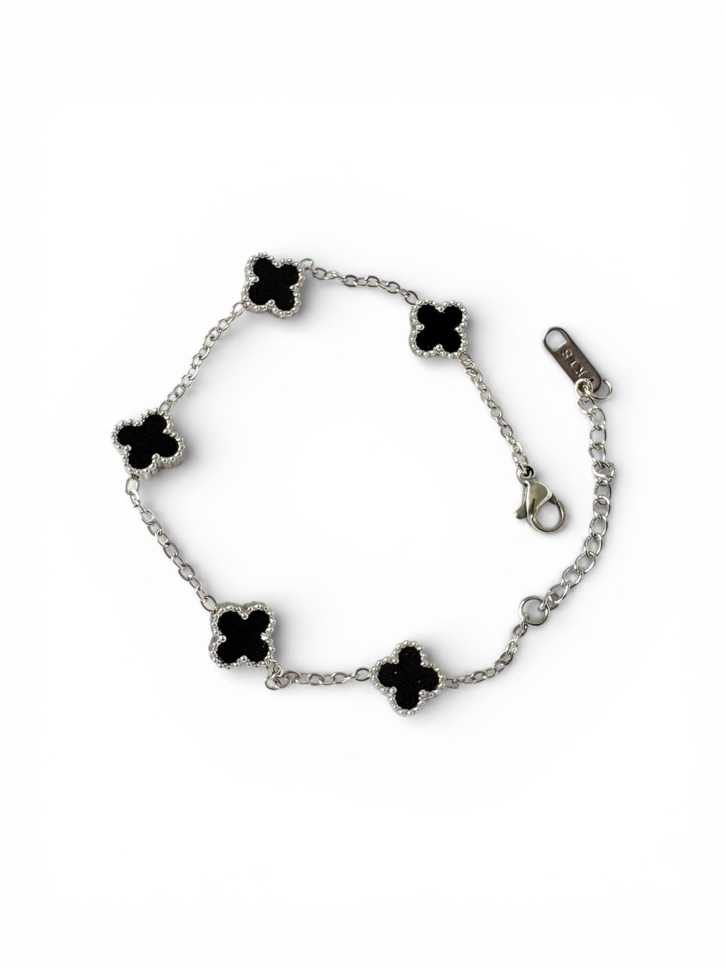 Black clover station bracelet in silver-tone stainless steel