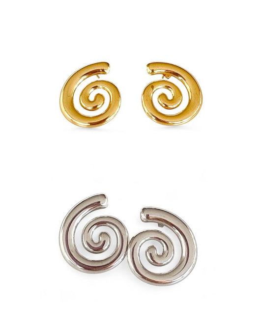 Pair of spiral-shaped earrings in gold and silver on a white background