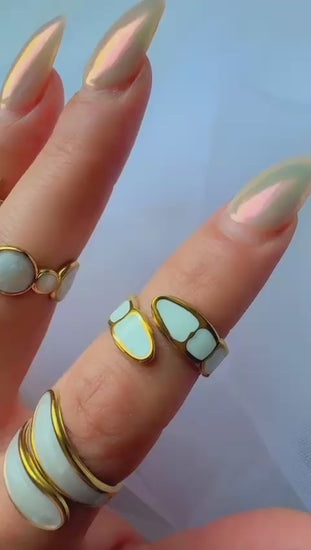 Modern gold statement ring with open band and natural shell finish